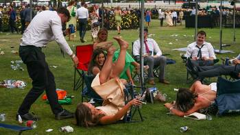 Drunken carnage at the races as 85,000 punters get legless celebrating the Melbourne Cup