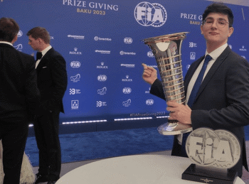 Hamilton dumps FIA award trophy with random fan, leaves Gala