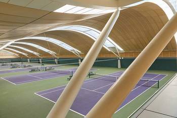 Hopkins Architects tops Wimbledon tennis courts with racket-informed roof