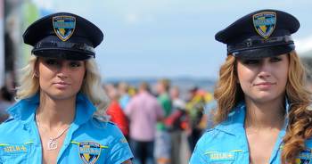 Hot grid girls dressed up as sexy policewomen complete with handcuffs and truncheon