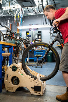 New shop tools may end mechanics' outdoor 'bed-in' rides. And that's a good thing.