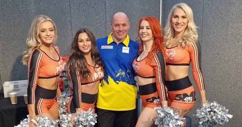 PDC Darts' Ukrainian qualifier poses with stunning dancers as he has time of his life at Ally Pally