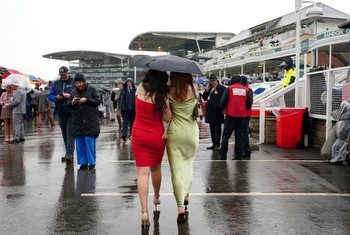 Racegoers brave downpours for Aintree’s Ladies Day