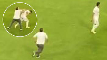 Watch shocking moment fan runs on to pitch and attacks Colombian football star... but wishes he hadn't