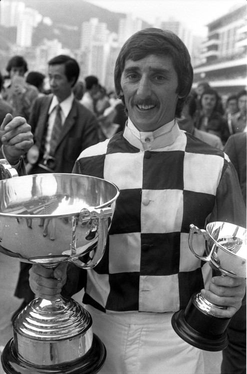 Jockey Bill Burnett celebrates winning the American Club Challenge Cup at Happy Valley in 1977. Photo: SCMP