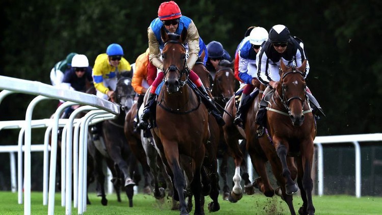 Gregory (red cap) leads the field en route to success in the Queen's Vase at Royal Ascot