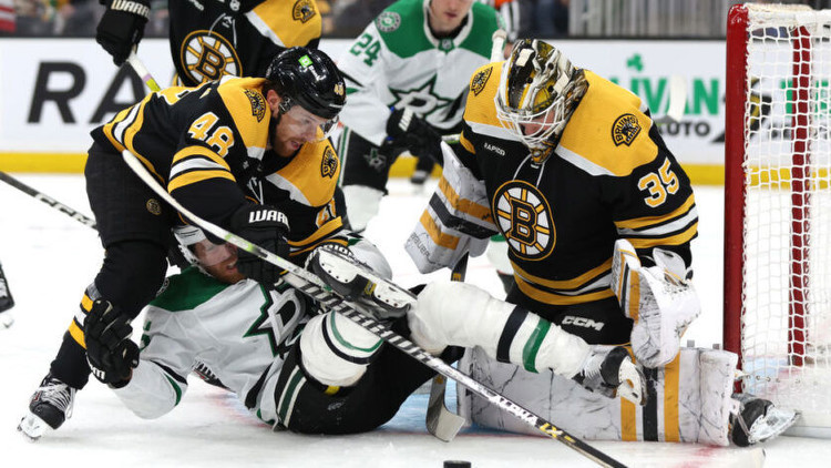 Matt Grzelcyk of the Boston Bruins collides with Joe Pavelski of the Dallas Stars. Photo by Getty Images.
