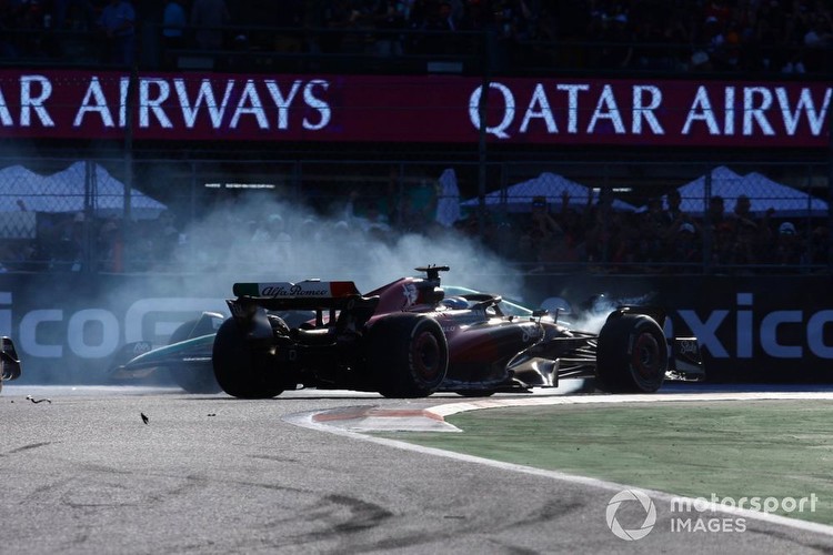 Lance Stroll, Aston Martin AMR23, spins while battling with Valtteri Bottas, Alfa Romeo C43 