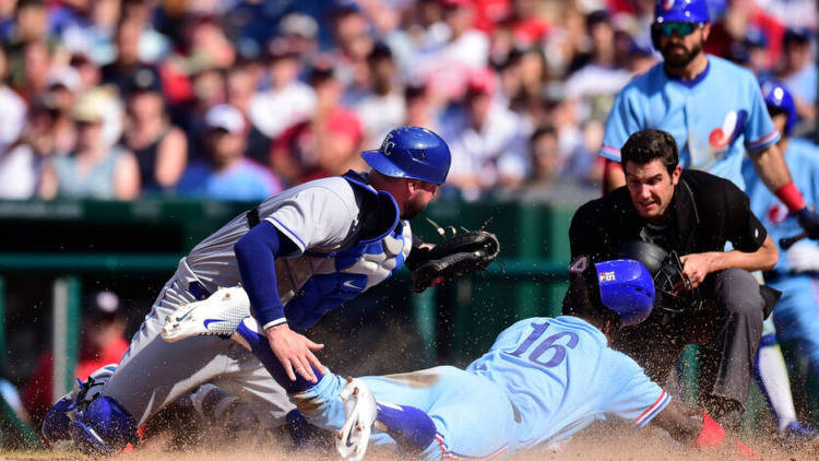 Victor Robles of the Washington Nationals scores a run against Cam Gallagher of the Kansas City Royals. Photo by Getty Images.
